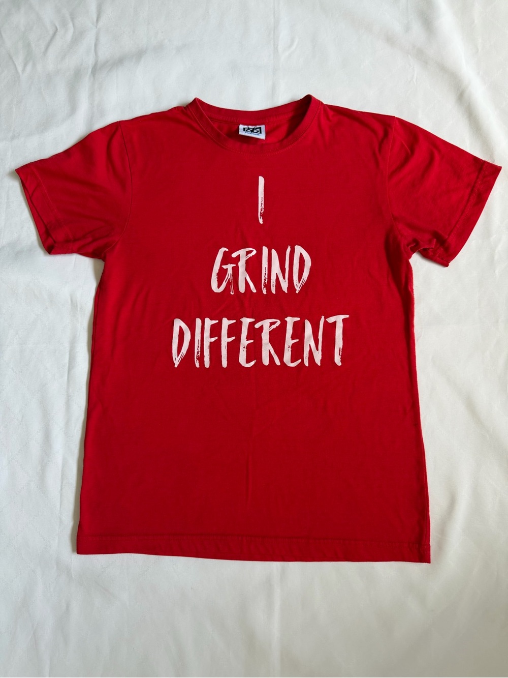 NG Red Graphic Women Tee with White 'I Grind Different' Text sz M. T045